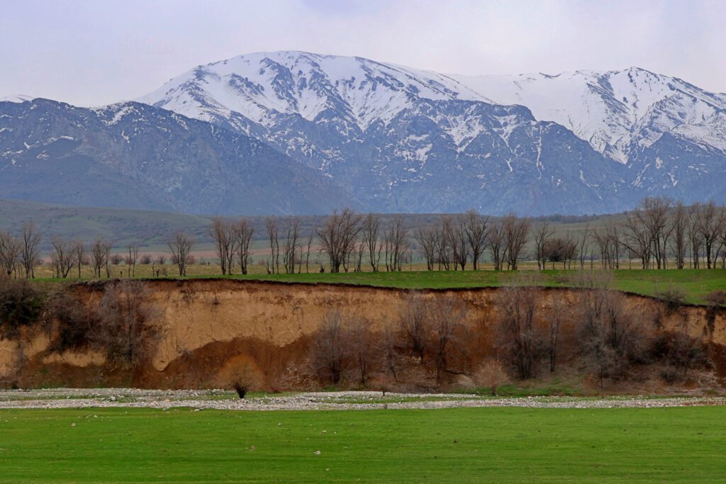 Info Shymkent - Snow-covered peaks of Sairam-Ugam mountain range near Shymkent during spring time